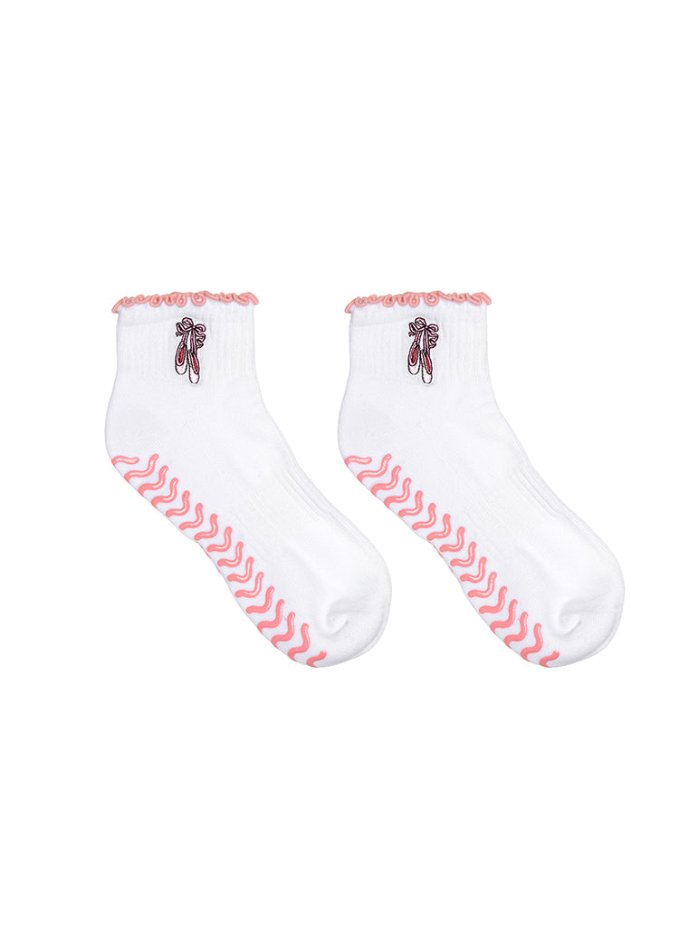 White socks with pink lining, equipped with stay-put grips to prevent slipping, featuring a small ballet-themed print, shown on a white background.