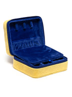 Yellow jewelry zip case with compartments for organizing jewelry, displayed on a white background.