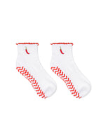 White socks with super sticky, stay-put grips to help prevent slipping on a white background.