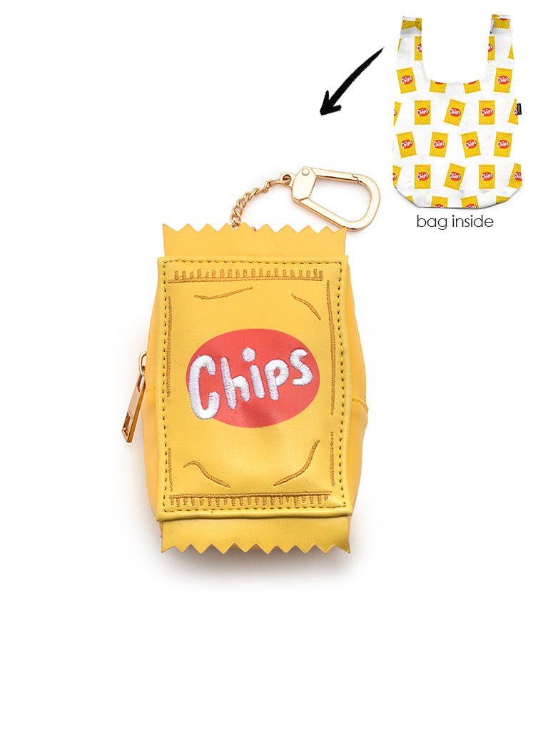2-in-1 bag charm featuring “Chips” text embroidery and a matching shopper bag with a chips print, displayed on a white background.