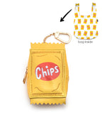 2-in-1 bag charm featuring “Chips” text embroidery and a matching shopper bag with a chips print, displayed on a white background.