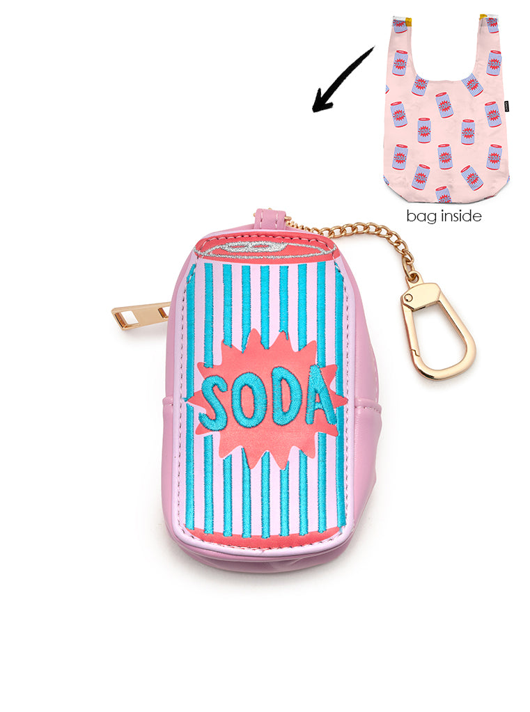 2-in-1 bag charm featuring SODA text embroidery and a shopper bag in a soda can print, displayed on a white background.