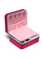 Red jewelry zip case with compartments for organizing jewelry, displayed on a white background.
