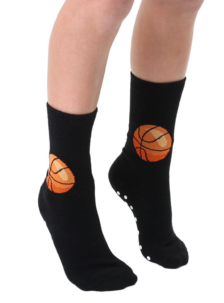 Black socks with 'Basketball ' graphic design on person with white background