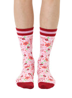 Pink and red women’s bamboo crew socks featuring a “Best Mom Ever” print with a floral pattern, shown worn on a person against a white background.