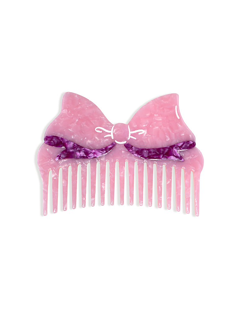Pink Hair comb featuring a pink bow design, displayed on a white background.