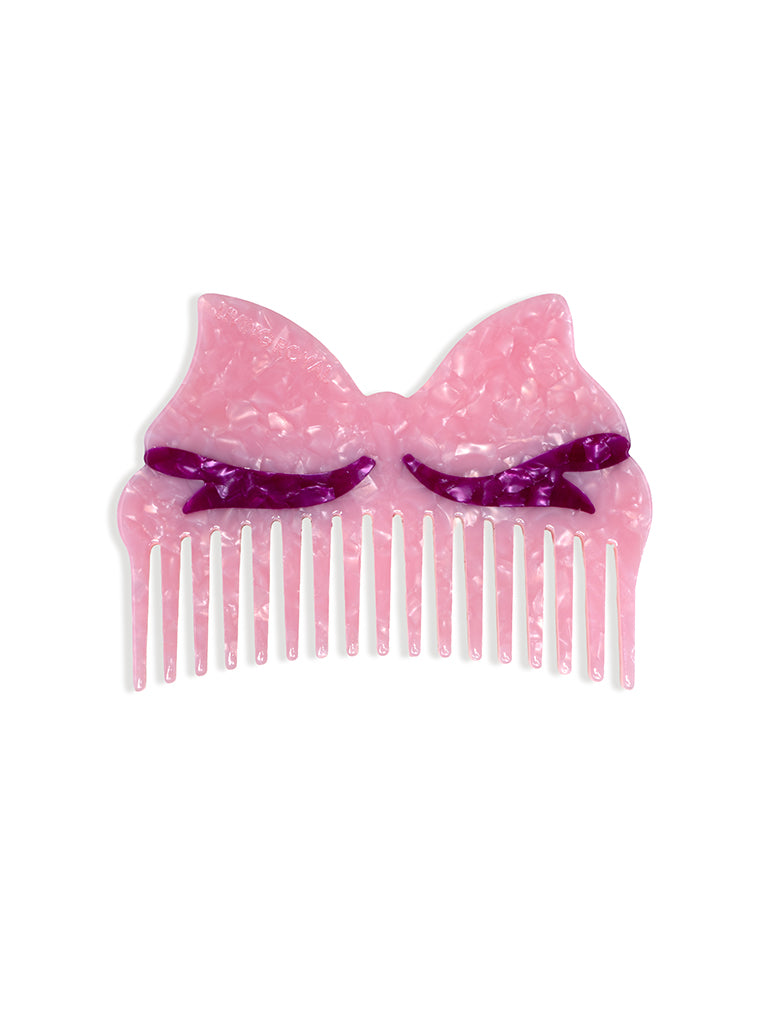 Pink Hair comb featuring a pink bow design, displayed on a white background.