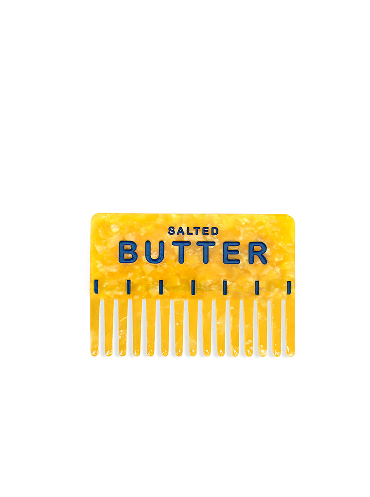 Hair comb featuring a salted butter design, displayed on a white background.