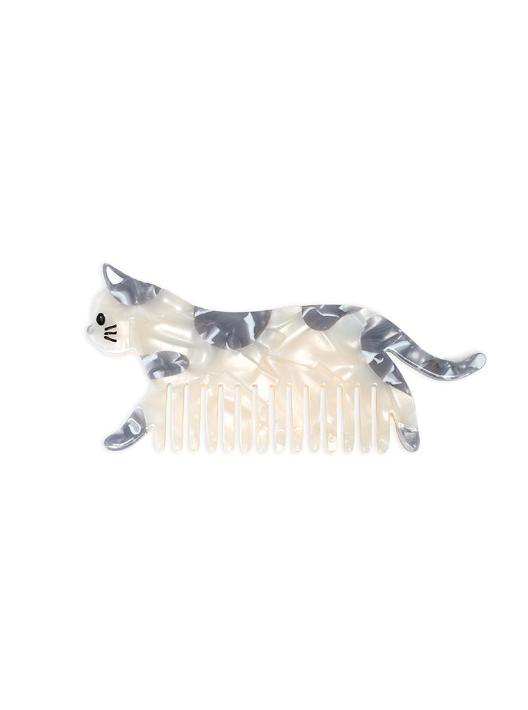 Hair comb featuring a white cat design, displayed on a white background.
