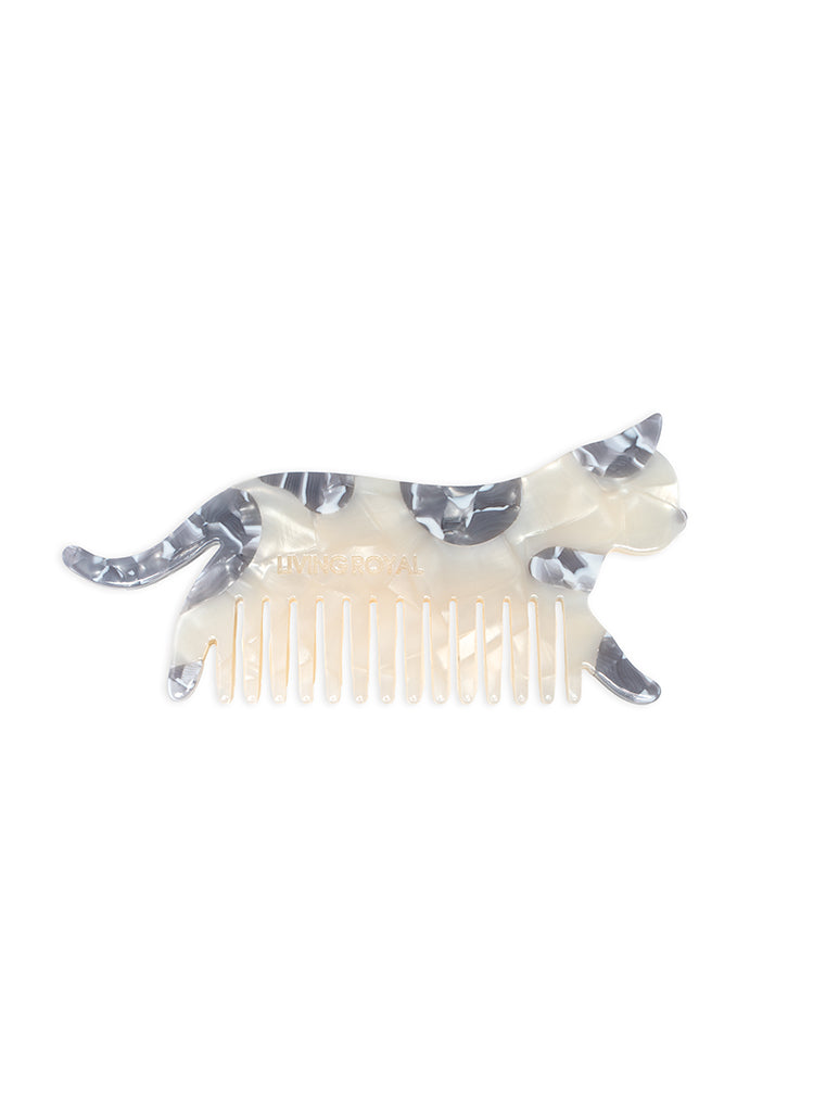 Hair comb featuring a white cat design, displayed on a white background.