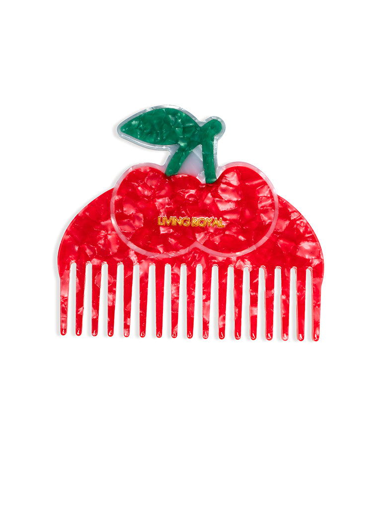 Hair comb featuring a cherry design, displayed on a white background.