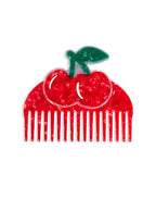 Hair comb featuring a cherry design, displayed on a white background.