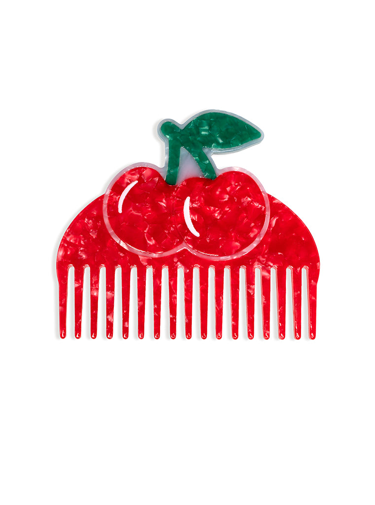 Hair comb featuring a cherry design, displayed on a white background.