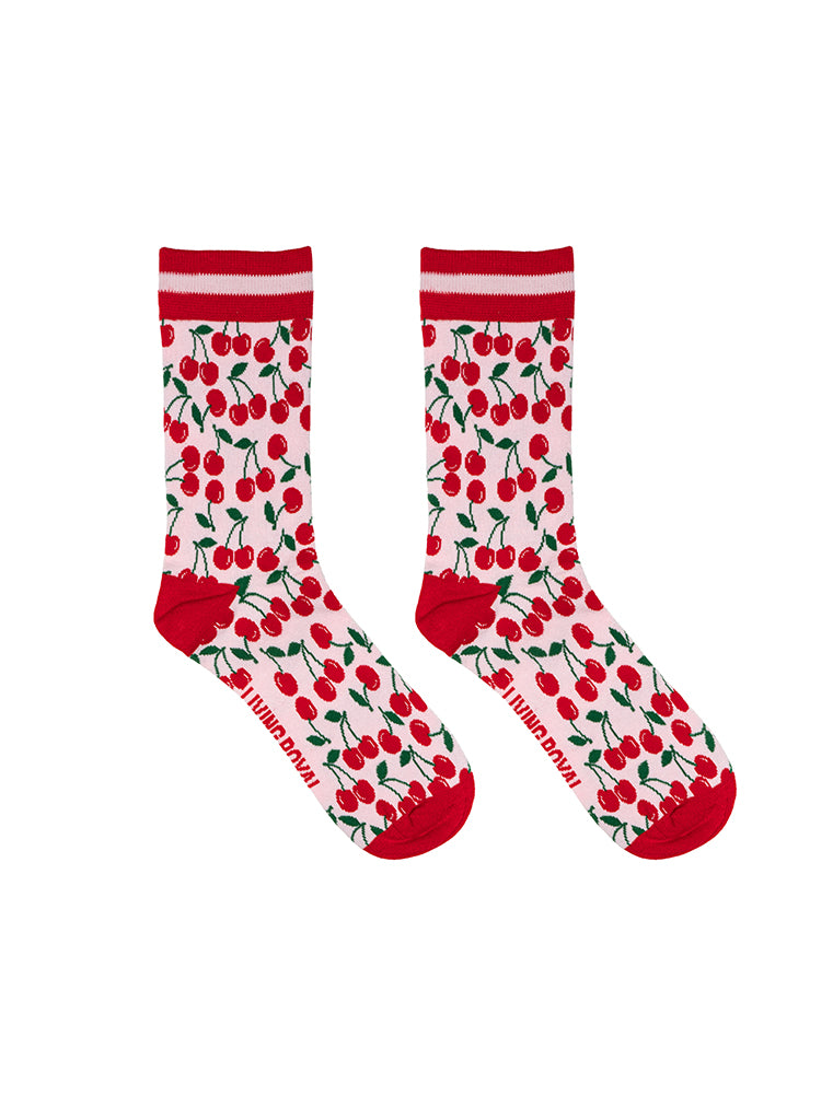 Red and light pink women’s bamboo crew socks featuring a cherry-themed pattern, shown on a white background.
