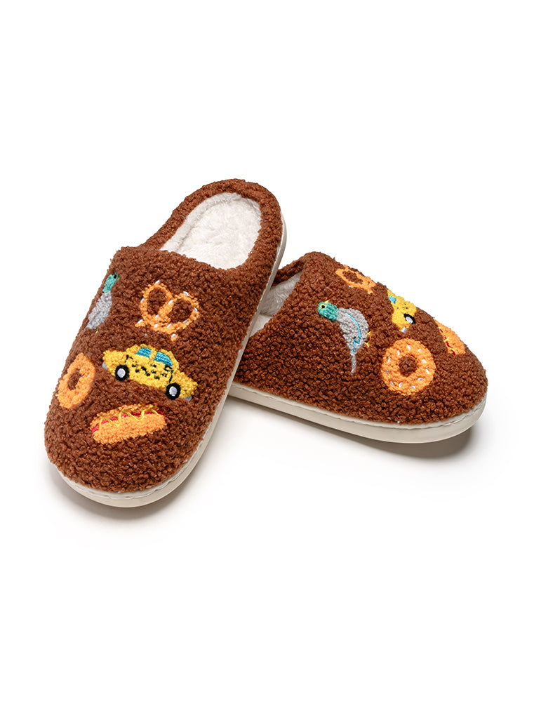 Brown slippers with cartoon designs on a white background