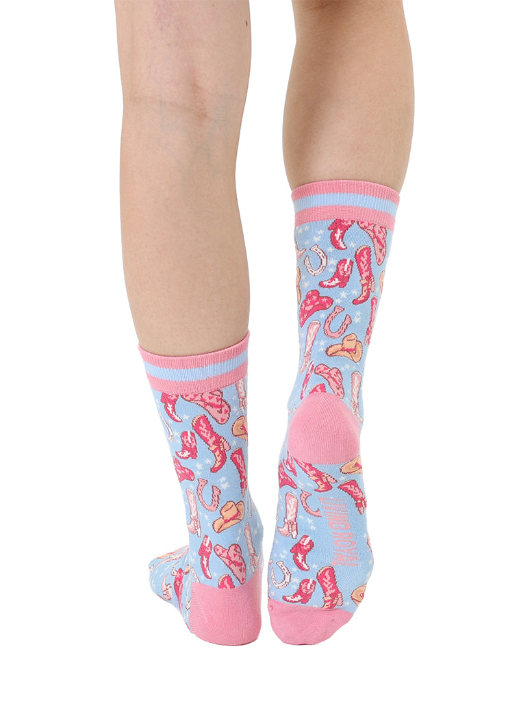 Pink and light blue women’s bamboo crew socks featuring a playful cowboy-themed pattern, shown worn on a person against a white background.