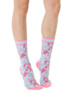 Pink and light blue women’s bamboo crew socks featuring a playful cowboy-themed pattern, shown worn on a person against a white background.