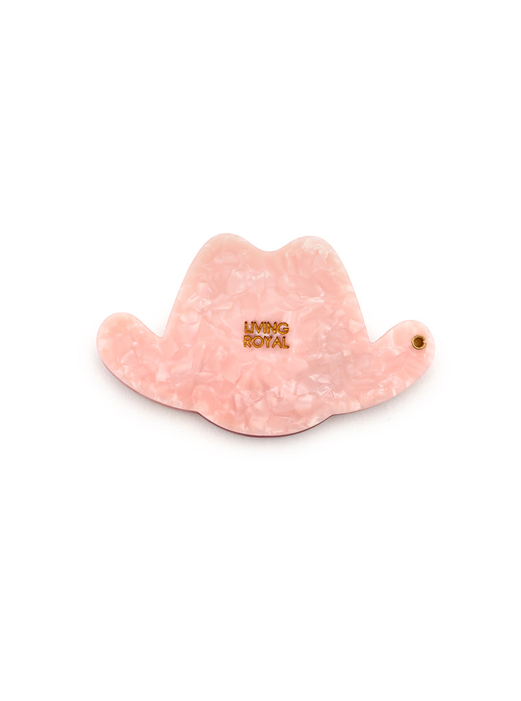 Pink compact mirror with a cowgirl hat design, a perfect pocket-sized accessory, displayed on a white background.