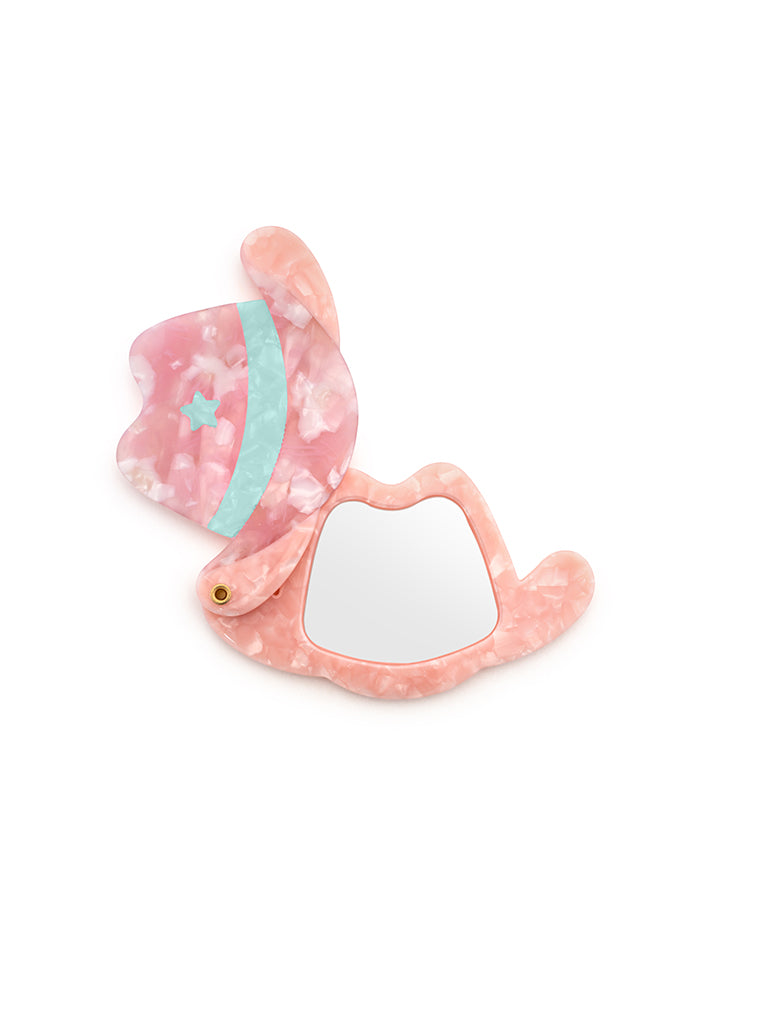 Pink compact mirror with a cowgirl hat design, a perfect pocket-sized accessory, displayed on a white background.