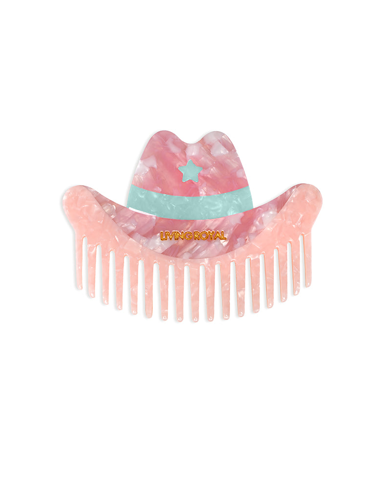 Hair comb featuring a pink cowgirl hat design, displayed on a white background.