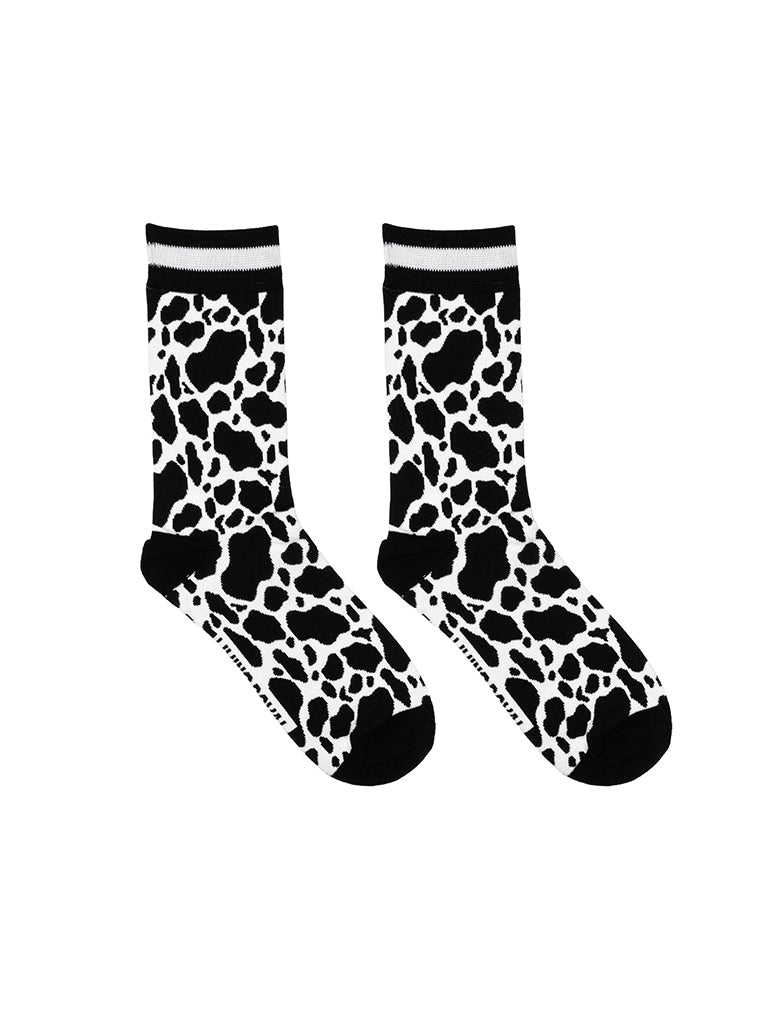 Women’s bamboo crew socks with a cow print pattern, shown on a white background.