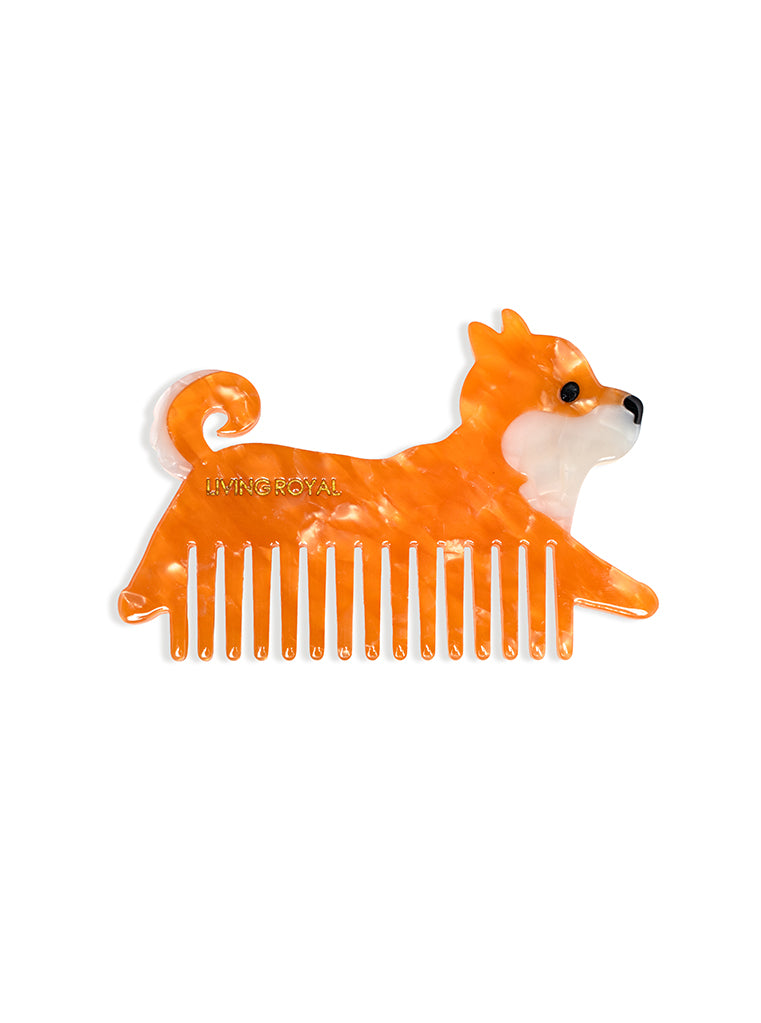 Hair comb featuring an orange dog design, displayed on a white background.