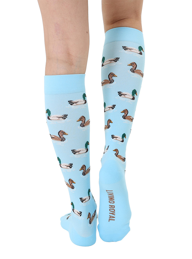 Lightblue padded compression socks featuring a white and brown ducks pattern, shown worn on a white background.