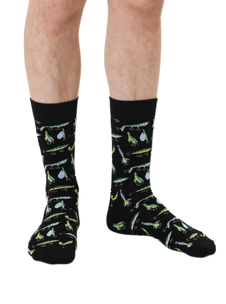 Black Men’s Bamboo Crew Socks with a fun fishing lure pattern. Worn on a crisp white background.