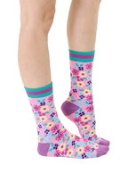 Light purple women’s bamboo crew socks with a vibrant floral pattern, shown worn on a person against a white background.