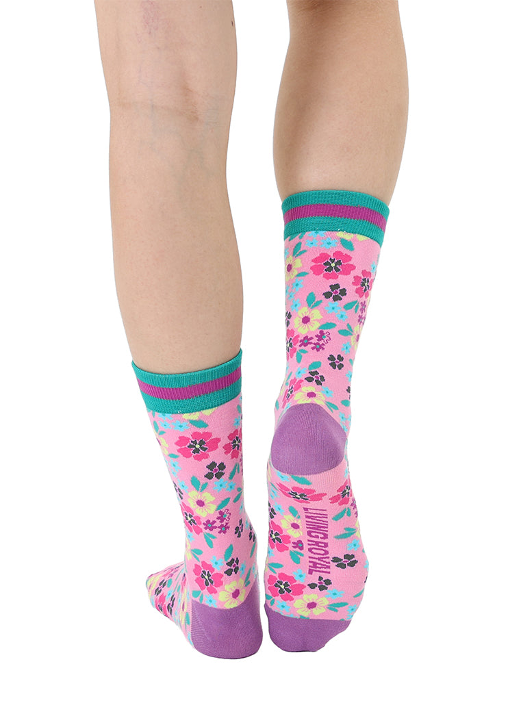 Light purple women’s bamboo crew socks with a vibrant floral pattern, shown worn on a person against a white background.