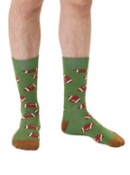 Green men’s bamboo crew socks featuring a football print, worn on a white background.