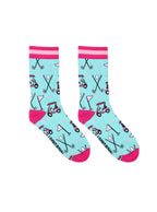 Light blue women’s bamboo crew socks with pink-striped cuffs, featuring a playful golf-themed print, shown on a white background.