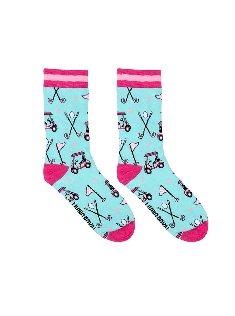 Light blue women’s bamboo crew socks with pink-striped cuffs, featuring a playful golf-themed print, shown on a white background.