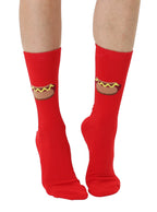 Red socks with hot dog design worn by a person on a white background