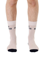 Beige men’s bamboo crew socks featuring a “Nap Master” slogan, shown worn on a white background.