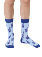 Blue color men’s bamboo crew socks featuring a fun “Number One Dad” print worn by a person on a white background