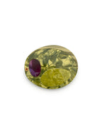 Compact mirror featuring a olive design, perfect for on-the-go use, displayed on a white background.