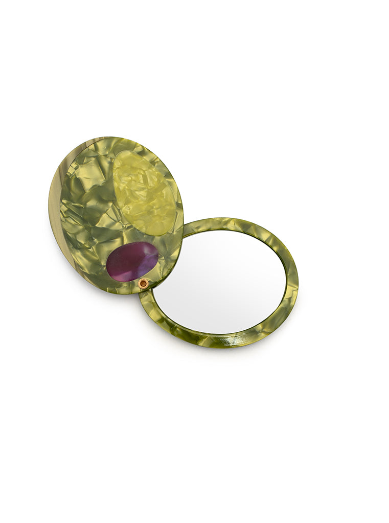 Compact mirror featuring a olive design with a hinged mechanism, perfect for on-the-go use, displayed on a white background.