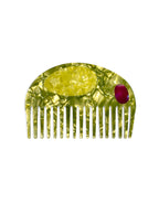 Hair comb featuring an olive design, displayed on a white background.