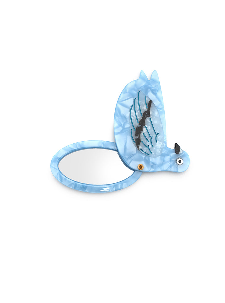 Compact mirror featuring a pigeon design with a hinged mechanism, perfect for on-the-go use, displayed on a white background.