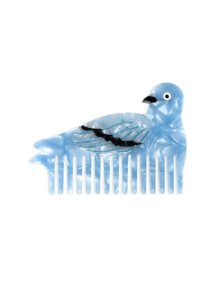 Hair comb featuring a pigeon design, displayed on a white background.