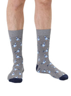 Grey men’s bamboo crew socks with a pigeon print, worn on a white background.