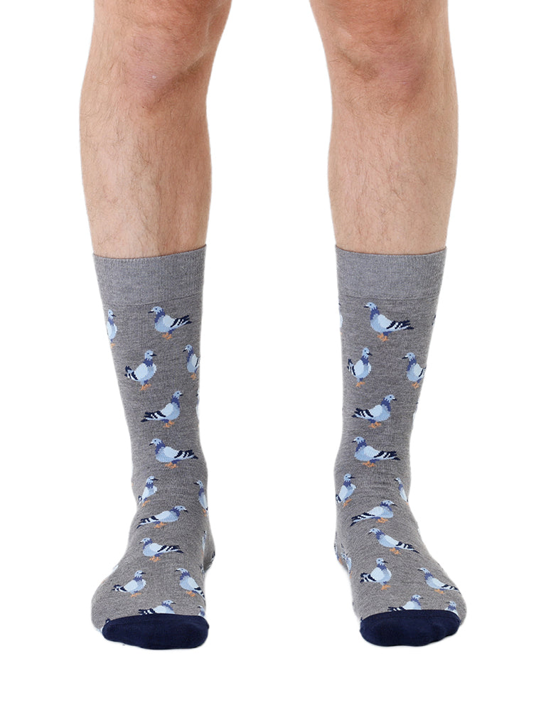 Grey men’s bamboo crew socks with a pigeon print, worn on a white background.