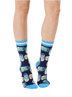 Blue women’s bamboo crew socks featuring a sardines can print, worn by a person on a white background
