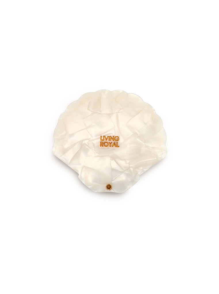 Compact mirror featuring a seashell design with a hinged mechanism, perfect for on-the-go use, displayed on a white background.