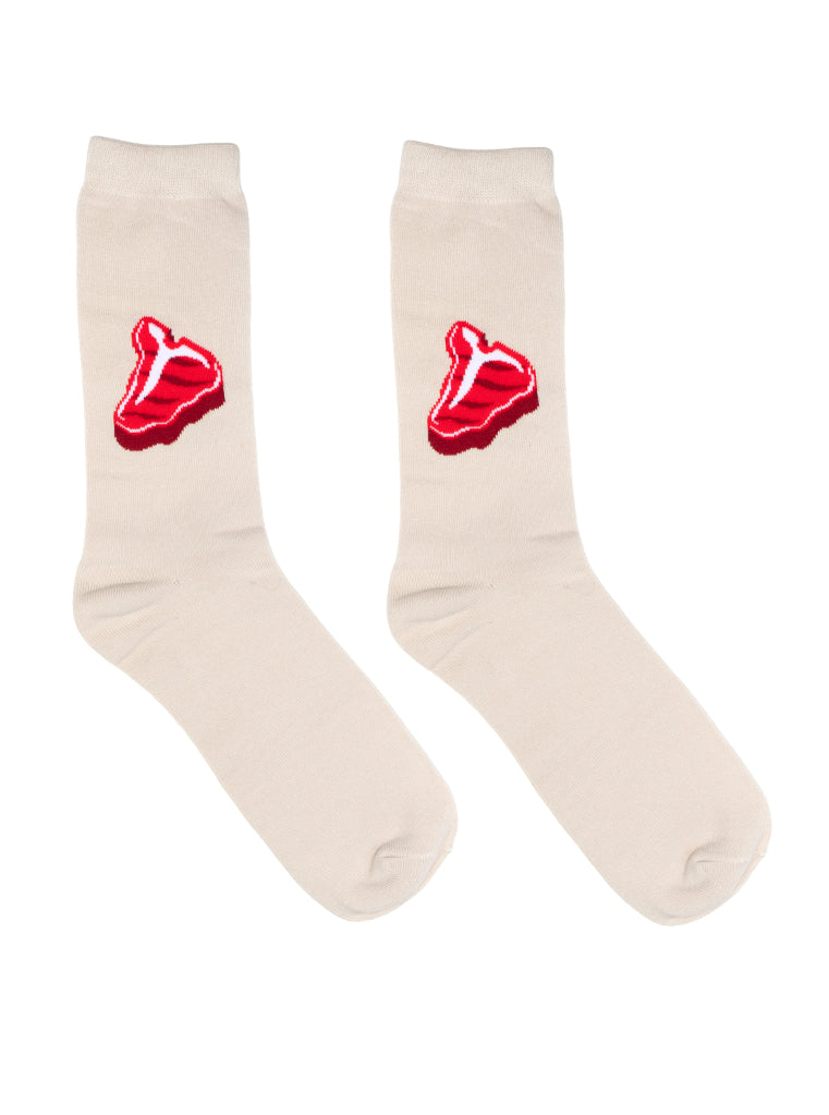 Beige socks with red steak design on a white background