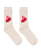 Beige socks with red steak design on a white background