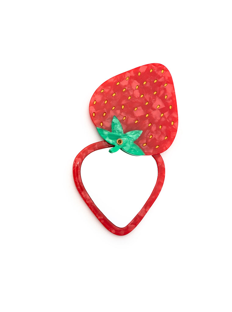 Compact mirror featuring a strawberry design with a hinged mechanism, perfect for on-the-go use, displayed on a white background.