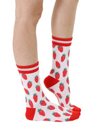 Red and light pink women’s bamboo crew socks featuring a strawberry-themed pattern, shown worn on a person against a white background.