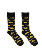 Black men’s bamboo crew socks with a yellow taxi print, on a white background.